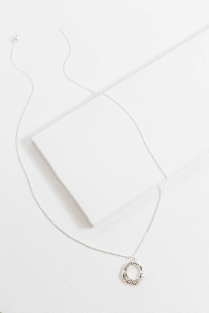 Flat lay showing full length of Charming Circle Necklace in Silver