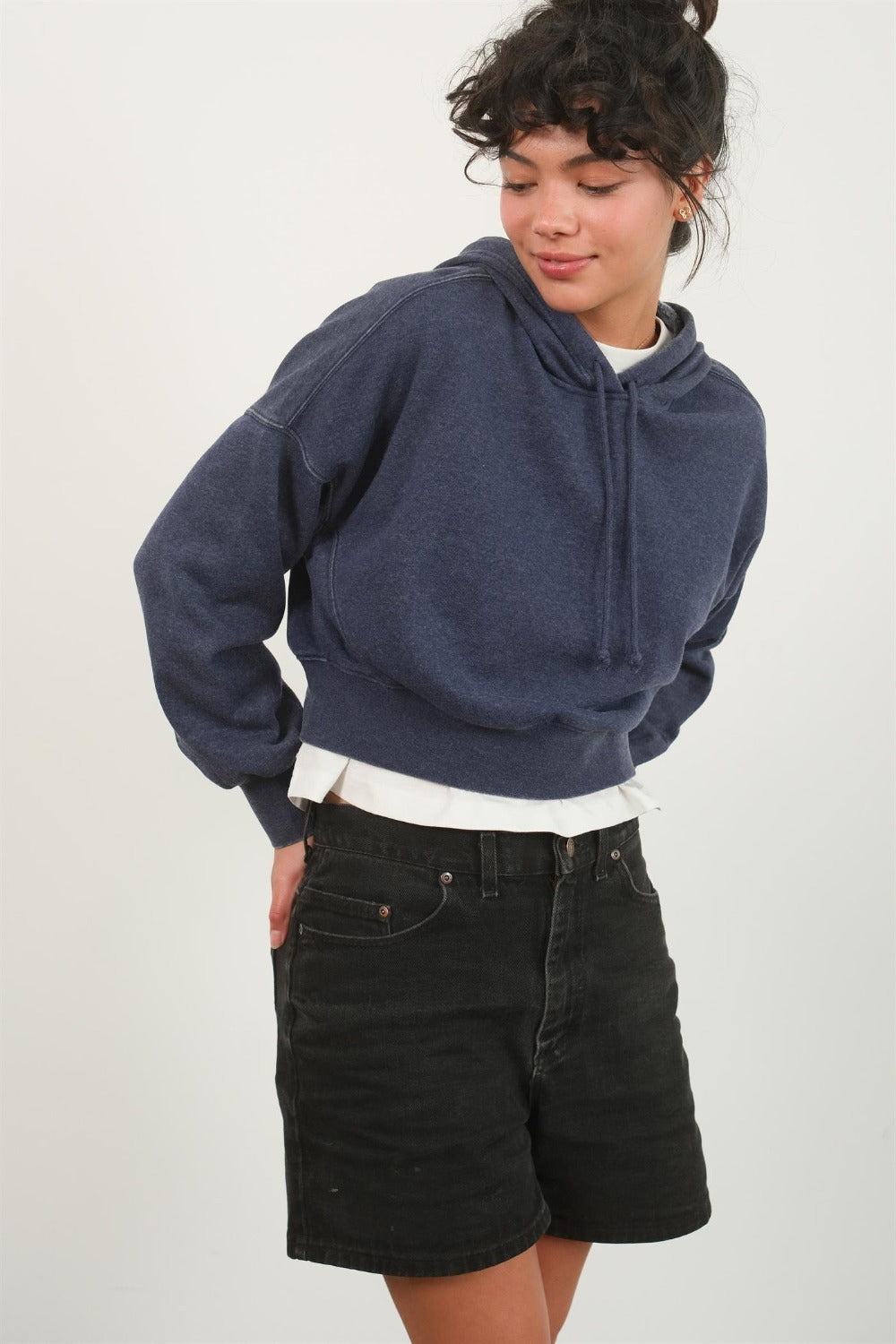 Dark navy cropped hoodie with a hood, drawstring, drop shoulder long sleeves, and a relaxed fit.