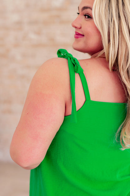 Close-up of Melanie Shoulder Tied Tank Top in Kelly Green, showing tied straps and lightweight crinkle woven fabric detail.