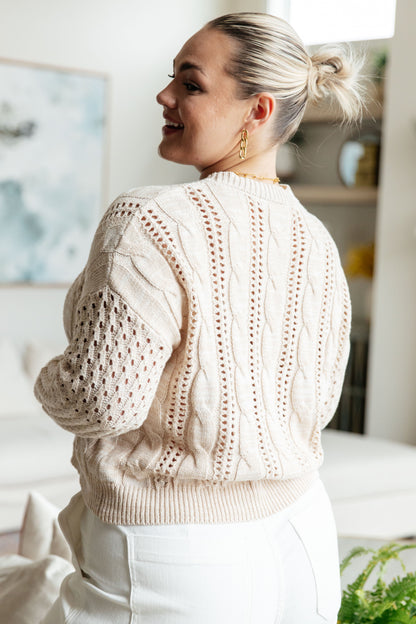 Plus size back view of Natalia Cream Cable Knit Sweater with ribbed hem and drop shoulder sleeves, classic layering piece.