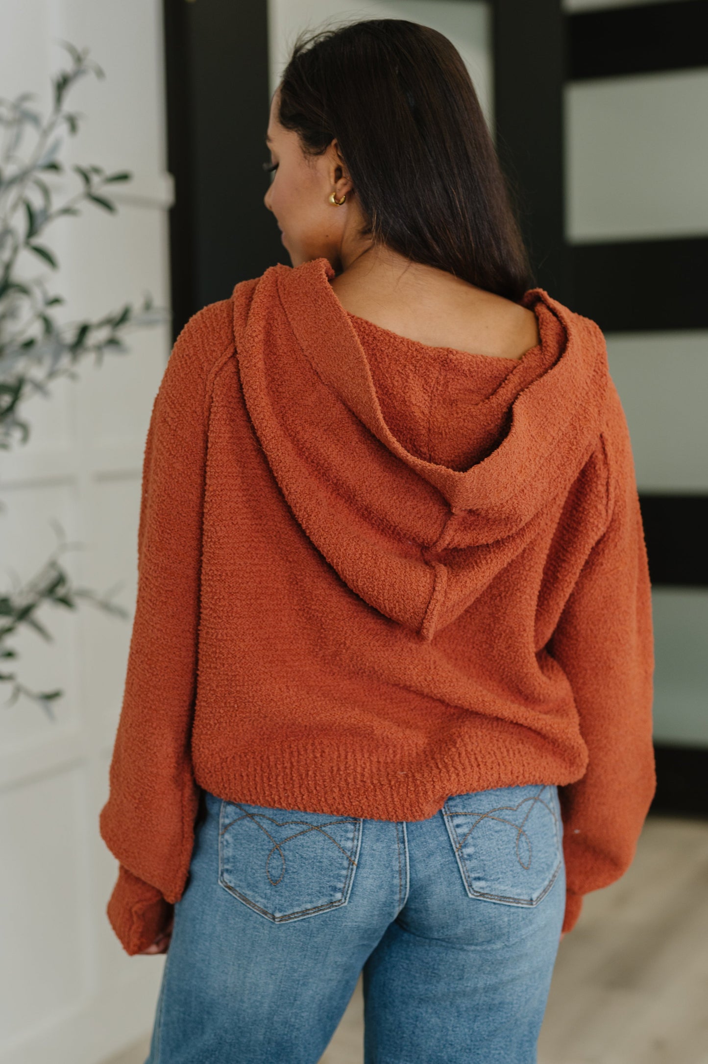 Back view of Callen Henley Sweater showing hood and relaxed knit design