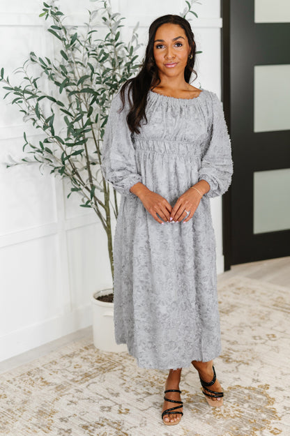 Full front view of Janelle Off Shoulder Floral Chiffon Midi Dress worn on-shoulder, featuring flowy silhouette and delicate floral print.