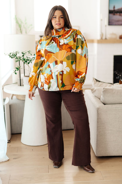 Plus size full body view of Dylan Mock Neck Blouse showing tangerine base with multi-colored florals