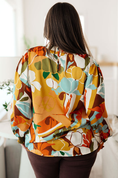 Plus size back view of Dylan Mock Neck Blouse showing button-up closure with floral satin finish