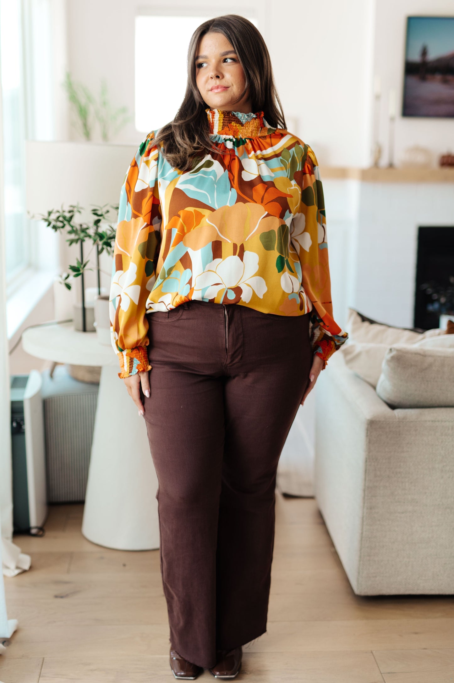 Plus size full body view of Dylan Mock Neck Blouse with satin finish, floral print, and smocked cuffs