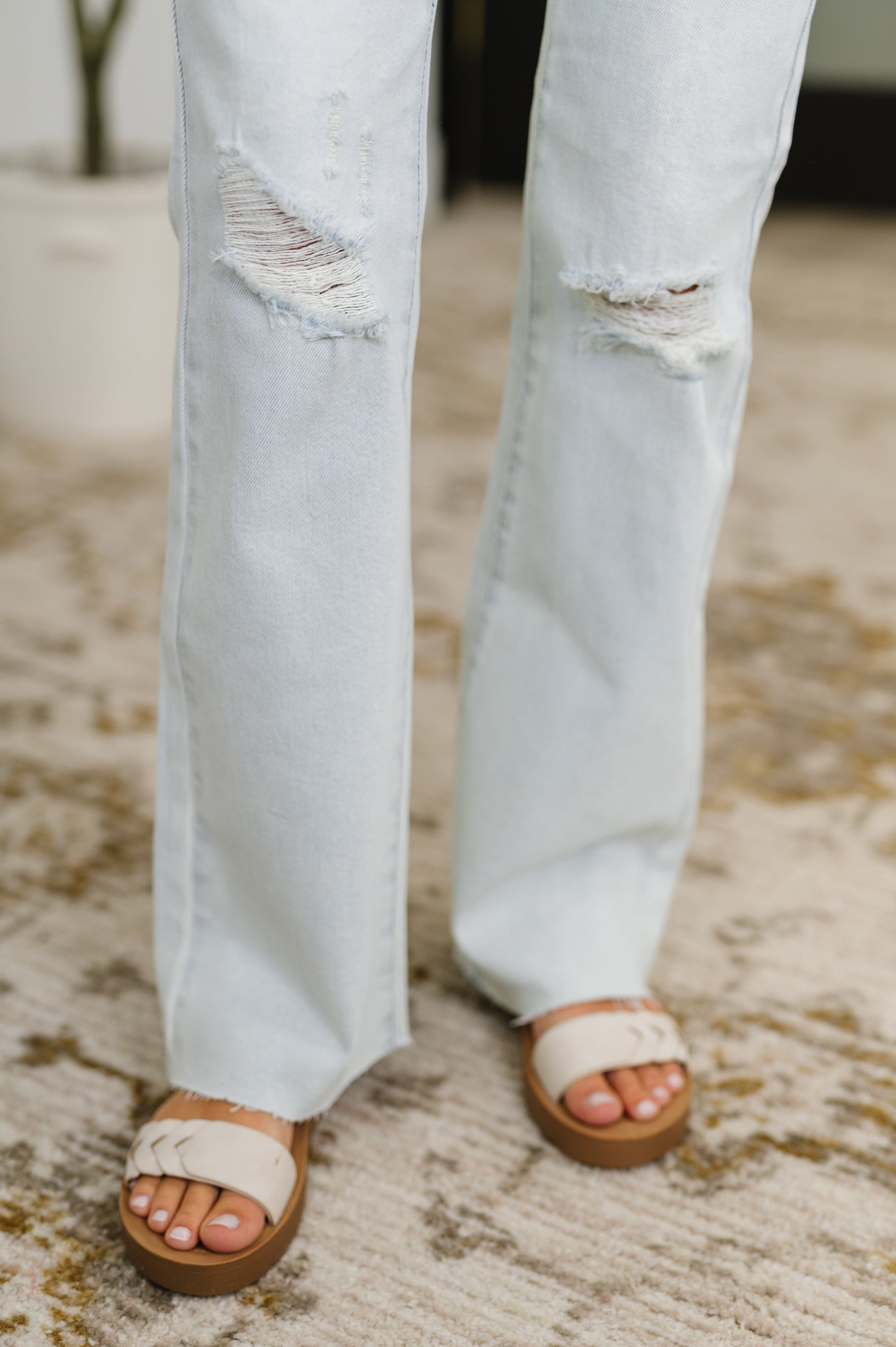 Close-up of frayed hem on Alyse Bootcut Judy Blue Jeans with light wash and distressed details.