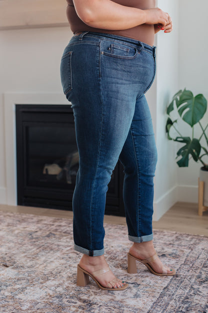 Side view of the Judy Blue plus size Amber cuffed slim fit dark wash jeans – mid-rise stretch.