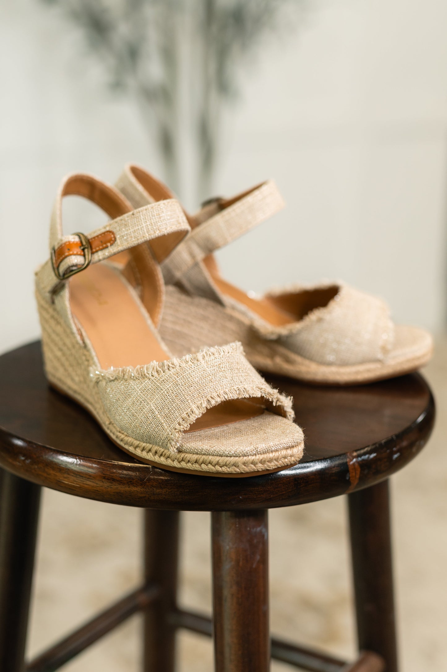 Arnold natural linen wedges highlighting braided twine sole, canvas texture, and 3 1/8" wedge heel.