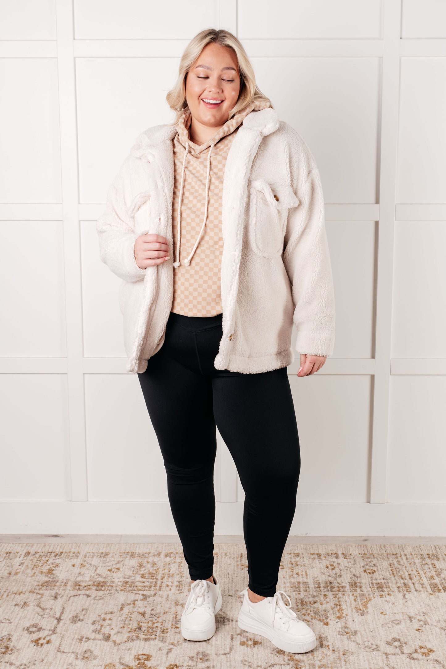 Plus size full body view of Dalia Checkered Hoodie paired with fuzzy jacket