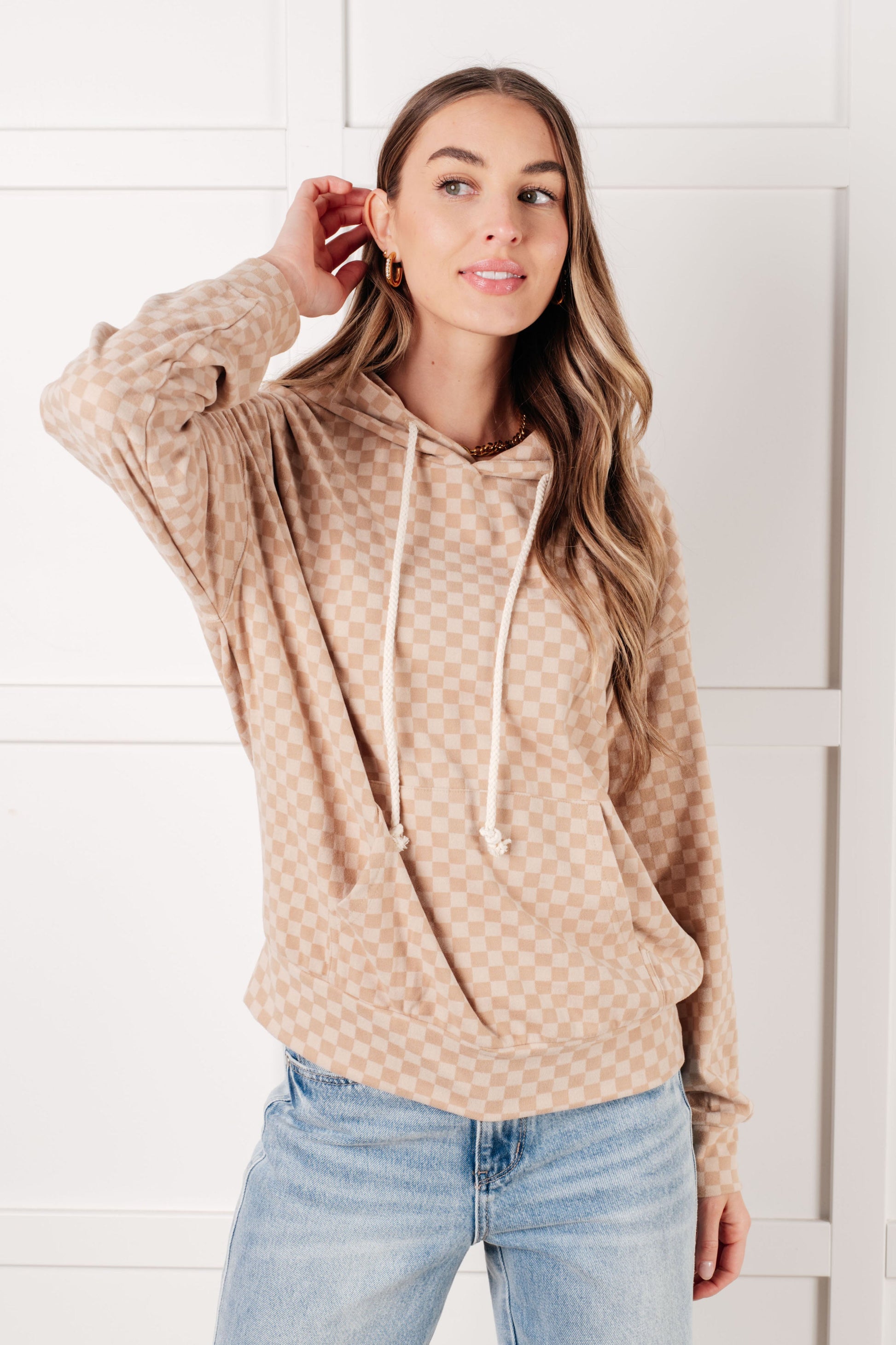 Front view of Dalia Checkered Hoodie in khaki featuring cream checker pattern and drawstring hood.