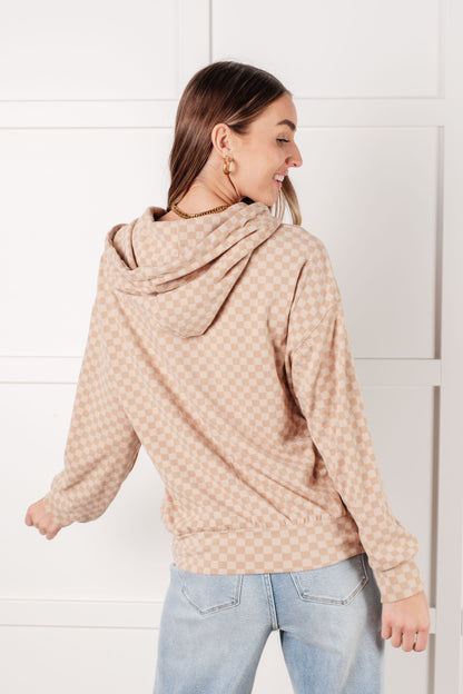 Back view of Dalia Checkered Hoodie in khaki showing cream checkered pattern and hood detail.