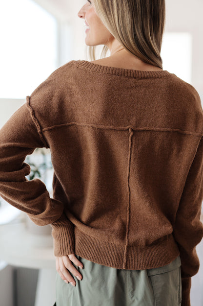 Back view of Bambi V-Neck Sweater in Mocha with relaxed fit and ribbed hem detail.