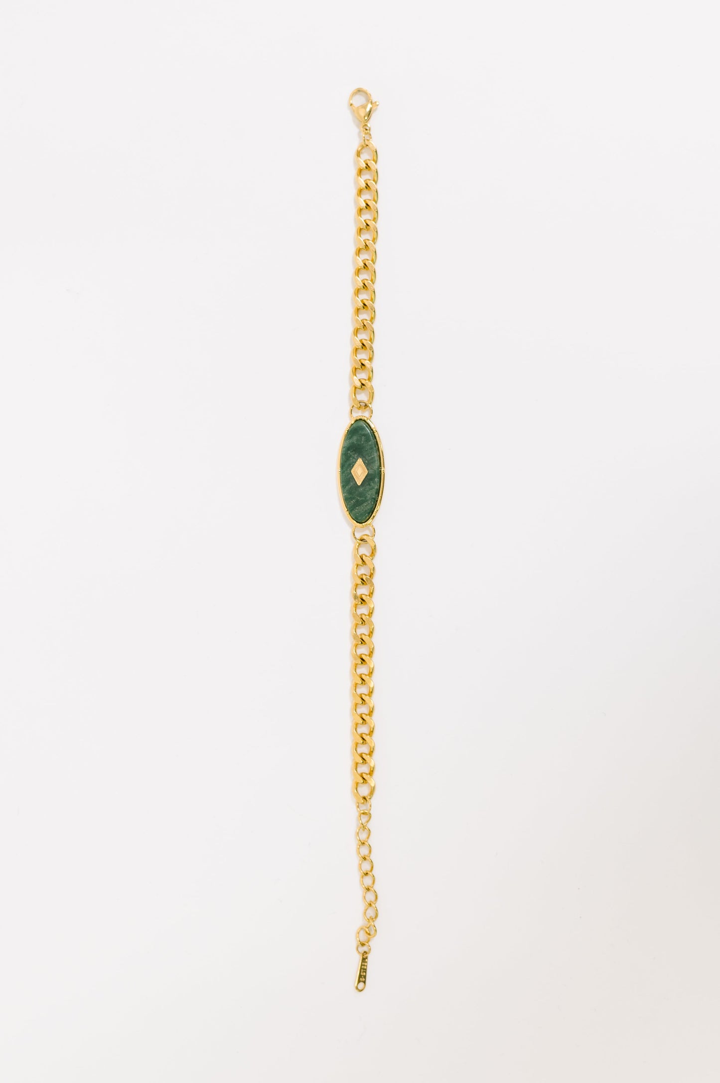 Flat lay of Bangle in Jade Bracelet showing jade accents and gold shine.