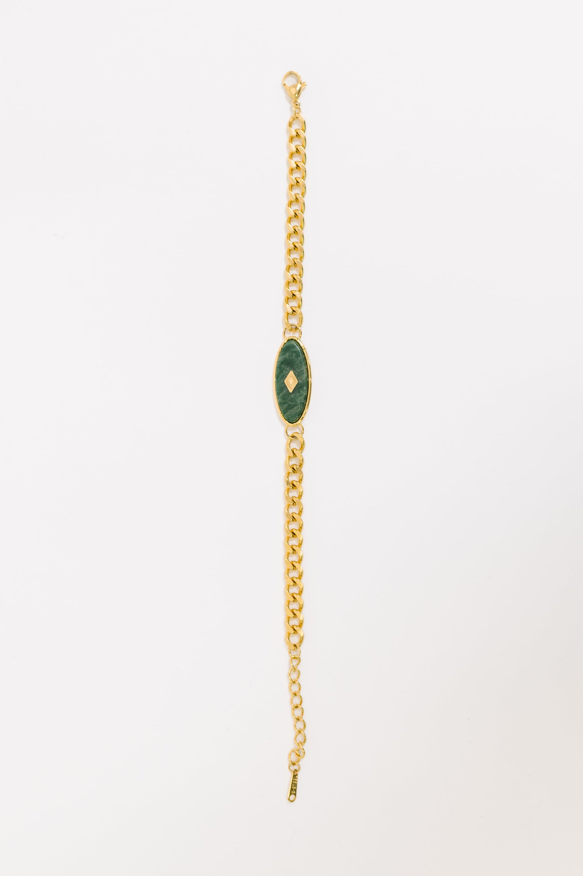 Flat lay of Bangle in Jade Bracelet showing jade accents and gold shine.
