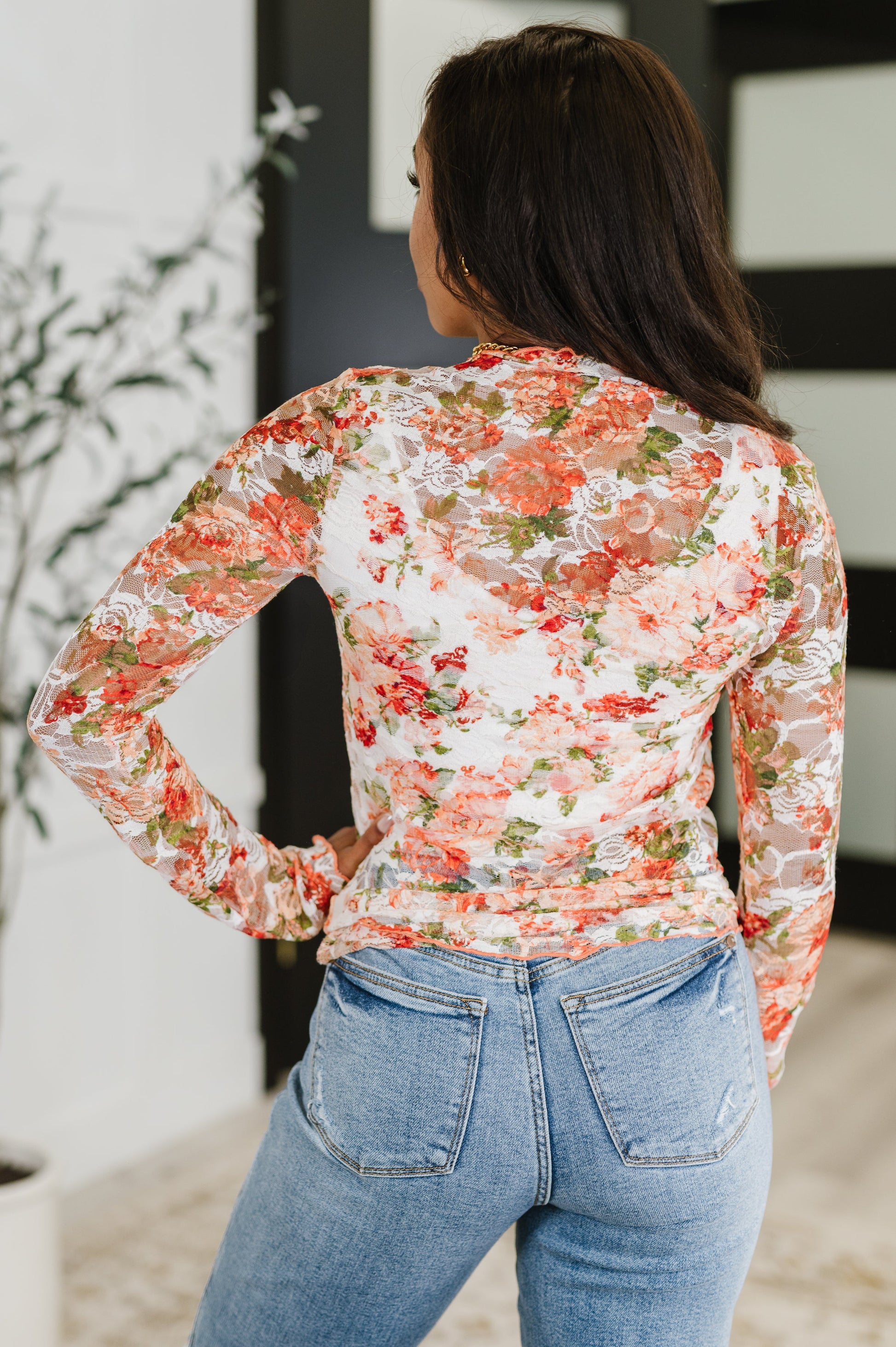 Plus size-friendly coral floral sheer top with long sleeves and high neck, ideal for layering and breathable comfort.

