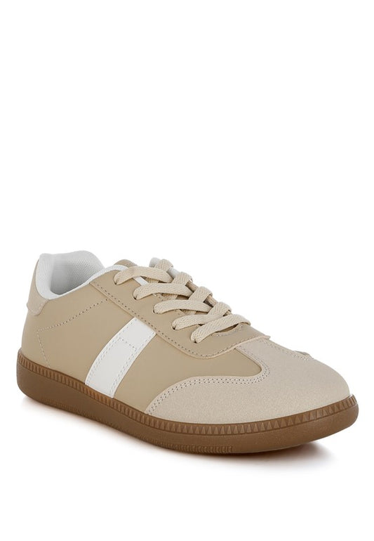 Beige crossover flatform sneakers with lace-up detail and round toe.