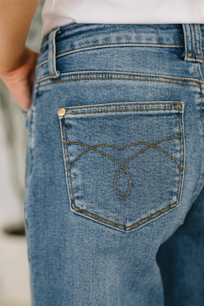Close-up of back pocket on Bella High Waist Soft Barrel Jeans with stitch-through detail in medium wash denim.