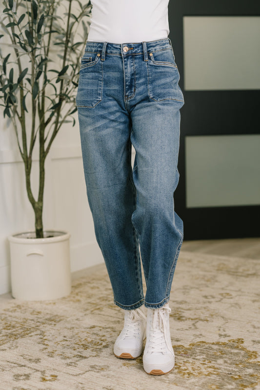 Front view of Bella High Waist Soft Barrel Jeans in medium wash with stitch-through pockets and flattering high-rise fit.