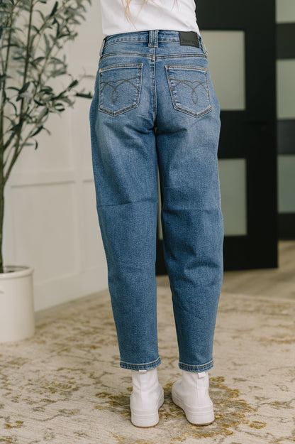 Back view of Bella High Waist Soft Barrel Jeans in medium wash with high-rise waist and relaxed barrel silhouette.