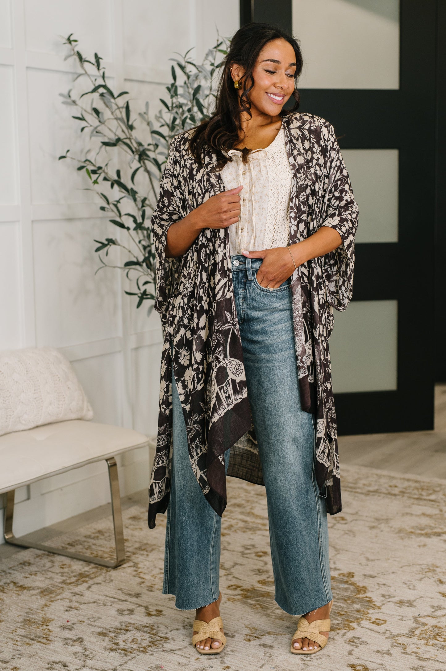 Model wearing Bella Vida Open Front Floral Print Kimono black floral with flowy silhouette.