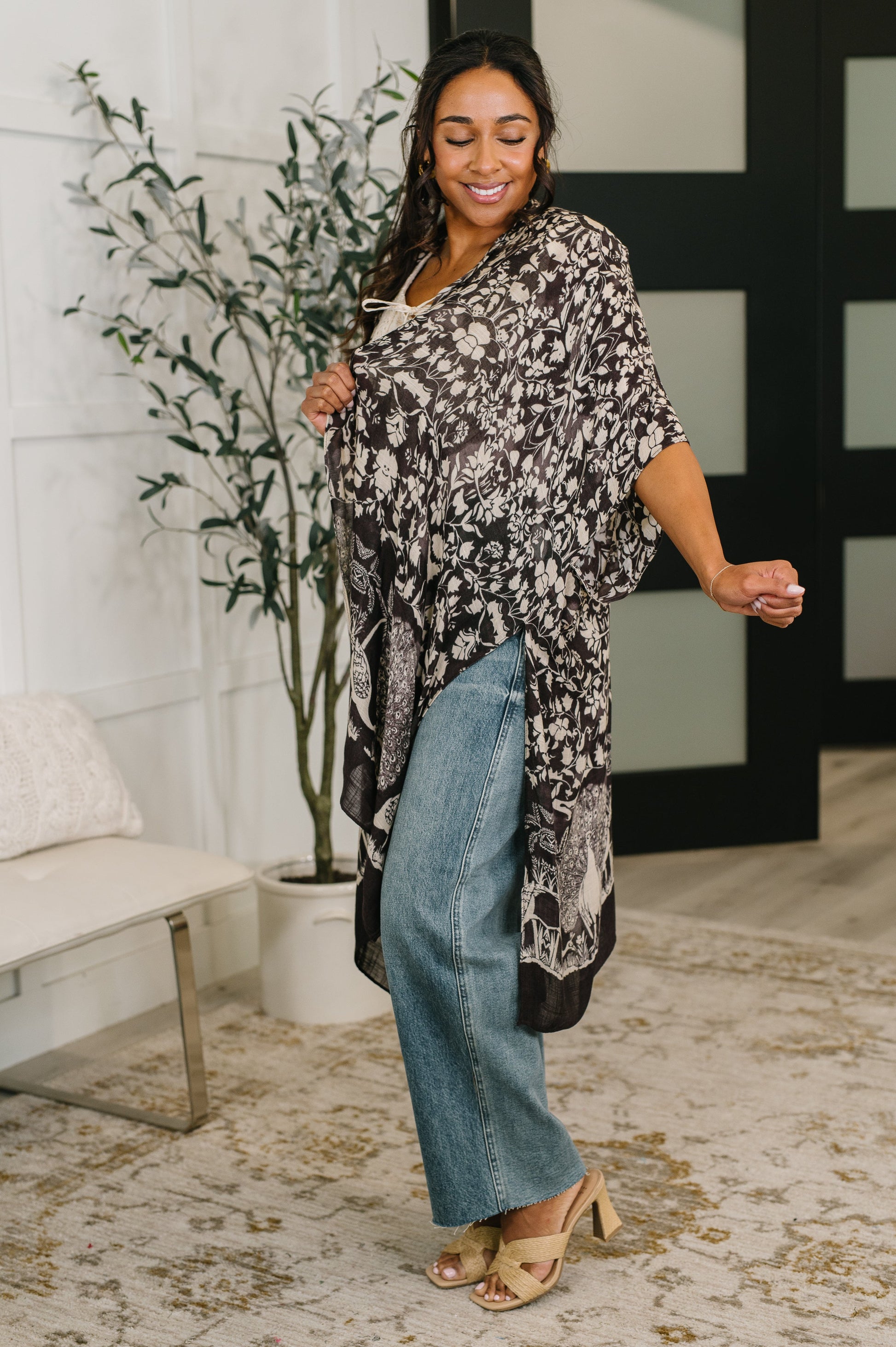 Angled view of Bella Vida Open Front Floral Print Kimono relaxed silhouette.