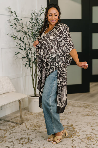 Angled view of Bella Vida Open Front Floral Print Kimono relaxed silhouette.