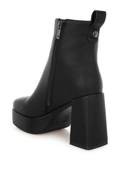 Back view of black Poulin Chelsea Boots highlighting block heel and cushioned insole.