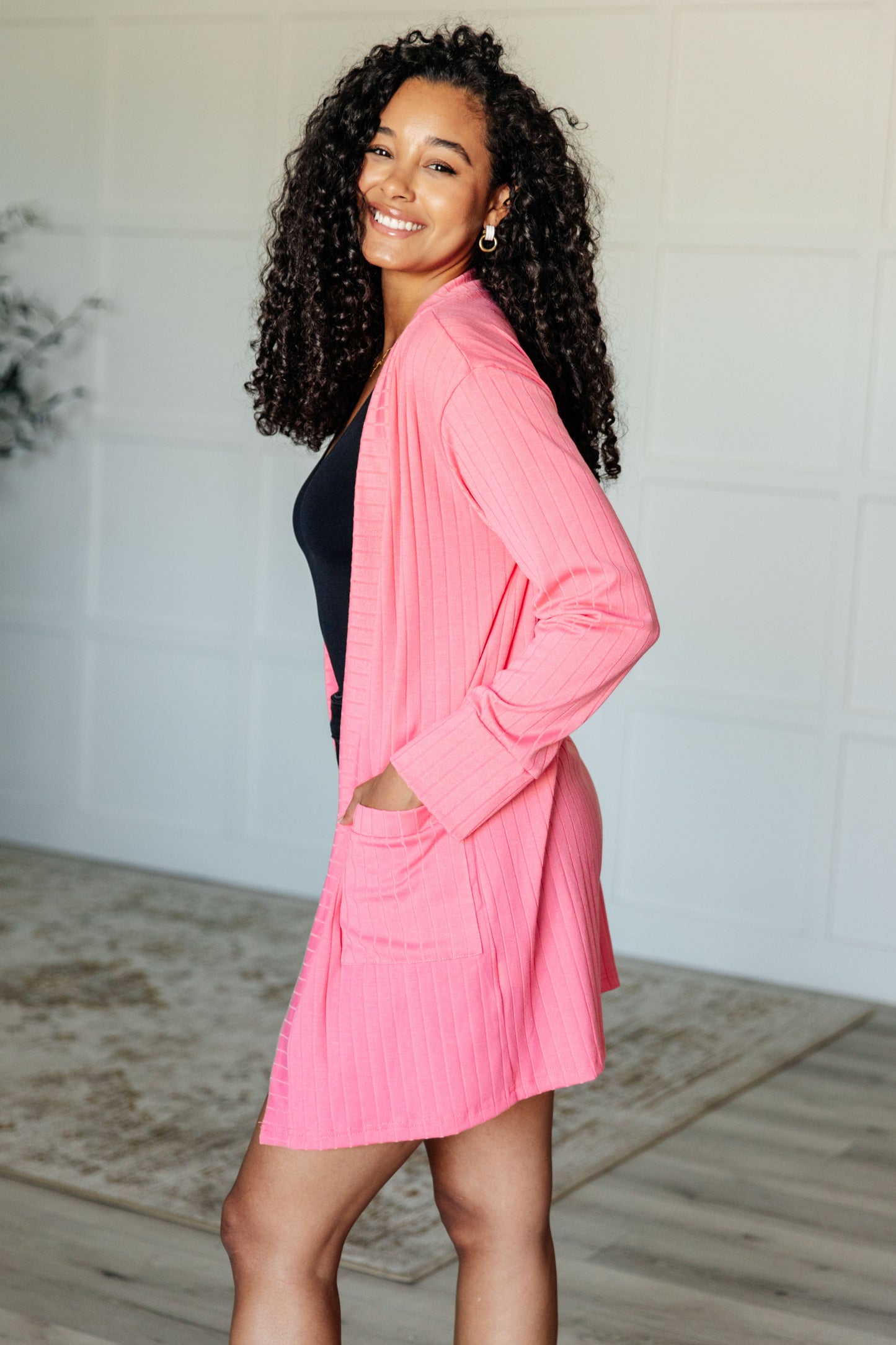 Blake Cardigan soft pink ribbed knit with oversized cuffs, side angle.