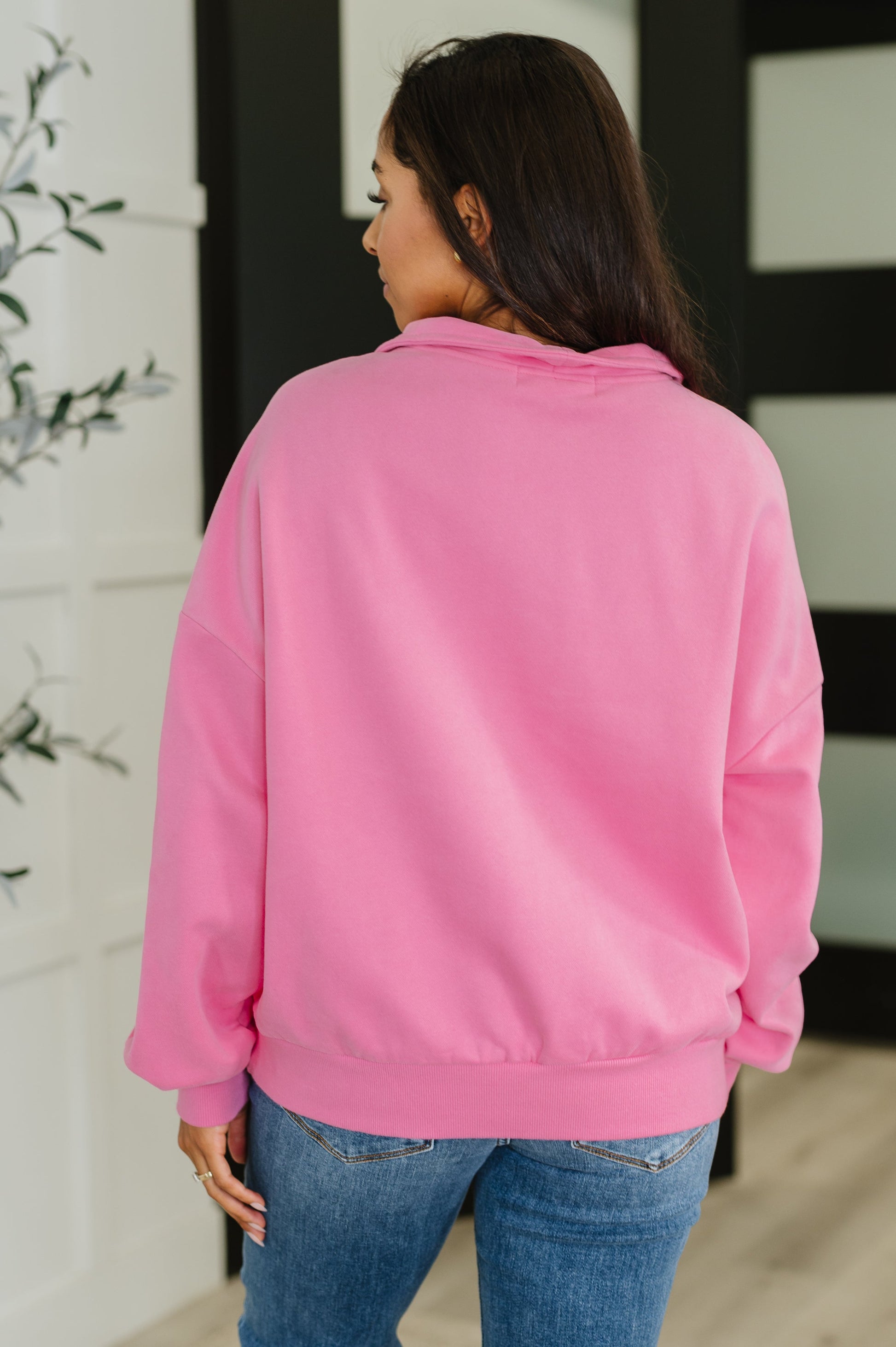 Back of Clarice Half Zip Pullover in pink fleece, relaxed drop shoulder fit with ribbed hemline