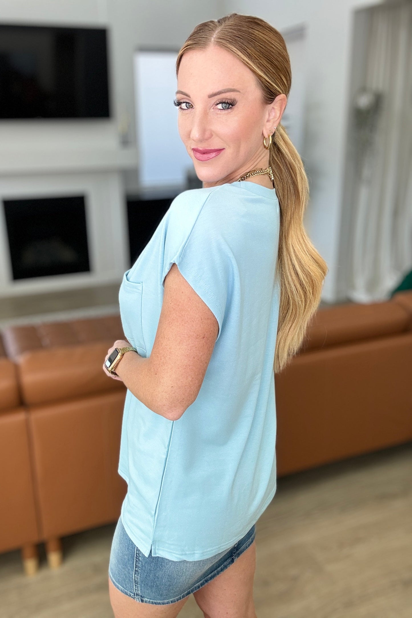 Side view Briar Pocket Tee in Blue, showing dolman sleeve and relaxed drape for a flattering fit.
