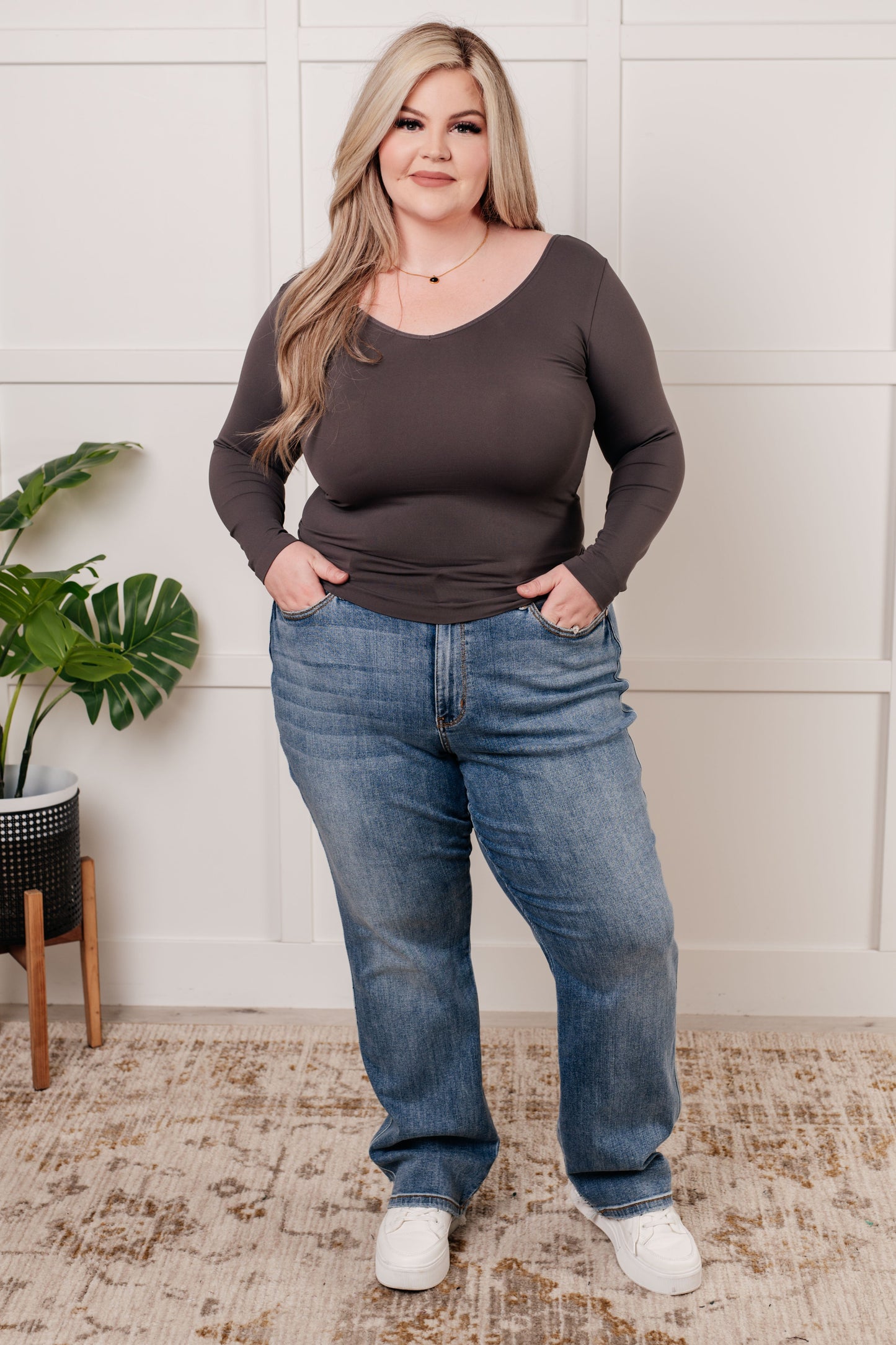 Charcoal long-sleeve reversible top with a scoop and V-neckline, made from soft brushed microfiber in a form-fitting silhouette.