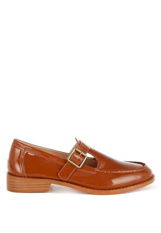 Side profile of brown Swenson Mary Jane Loafers, glossy finish with pin buckle strap and cushioned insole