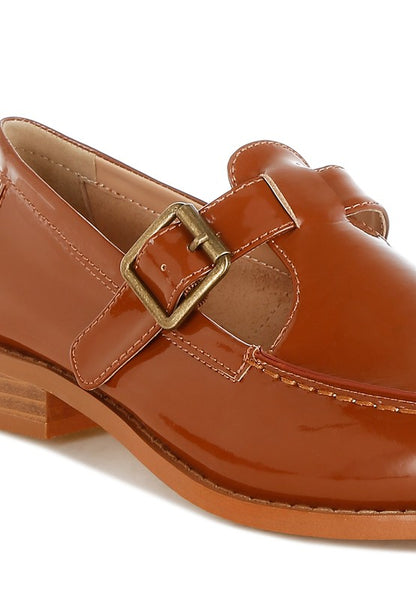 Close up of brown Swenson Mary Jane Loafers showing cushioned insole, glossy patent pleather finish, and stitch details

