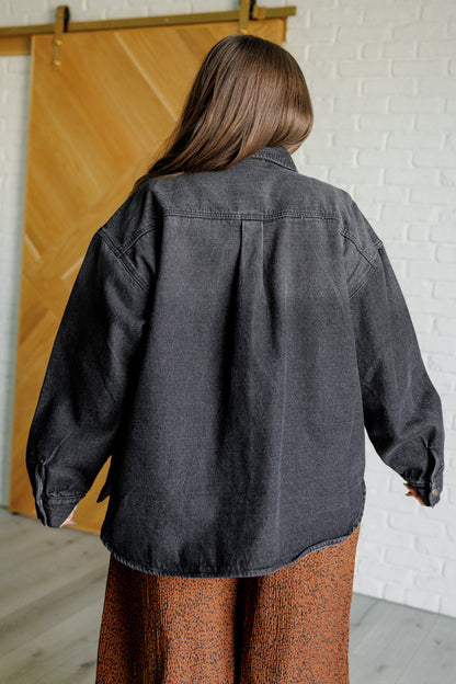 Plus-size model back view of Fia denim shacket showing oversized fit and washed cotton fabric.