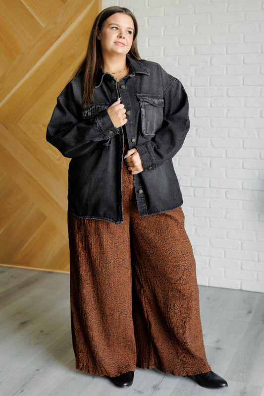 Plus-size model full body in Fia denim shacket styled with leggings for casual layered look.