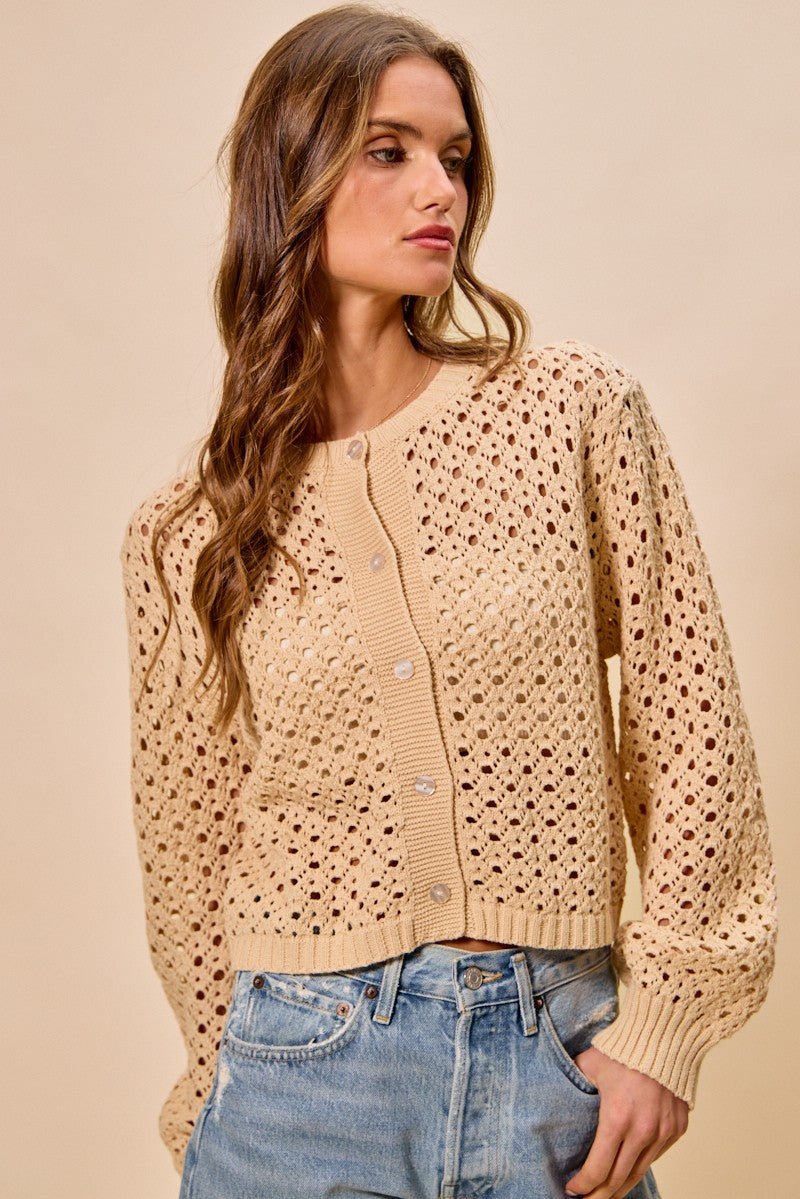 Model styling Casey Open Knitted Button Down Cardigan layered over tank top.