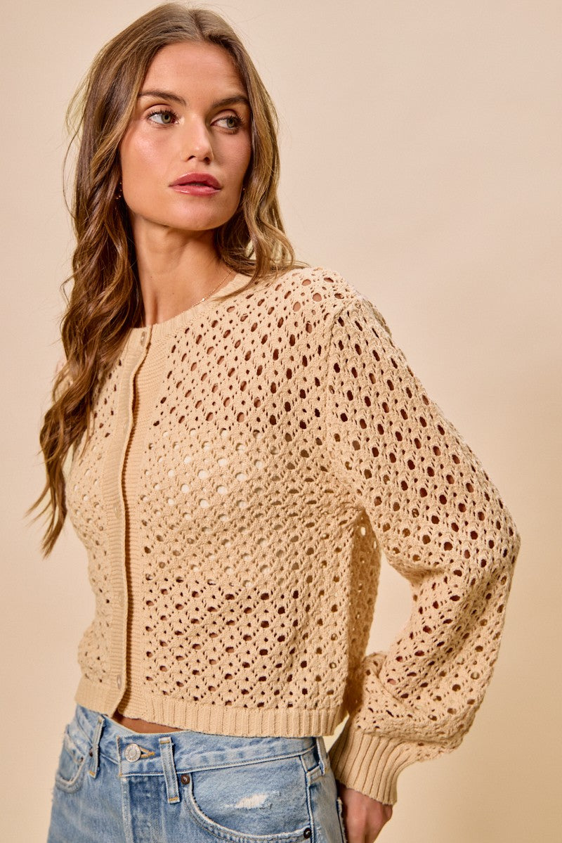 Angled view of Casey Open Knitted Button Down Cardigan lightweight layering piece.