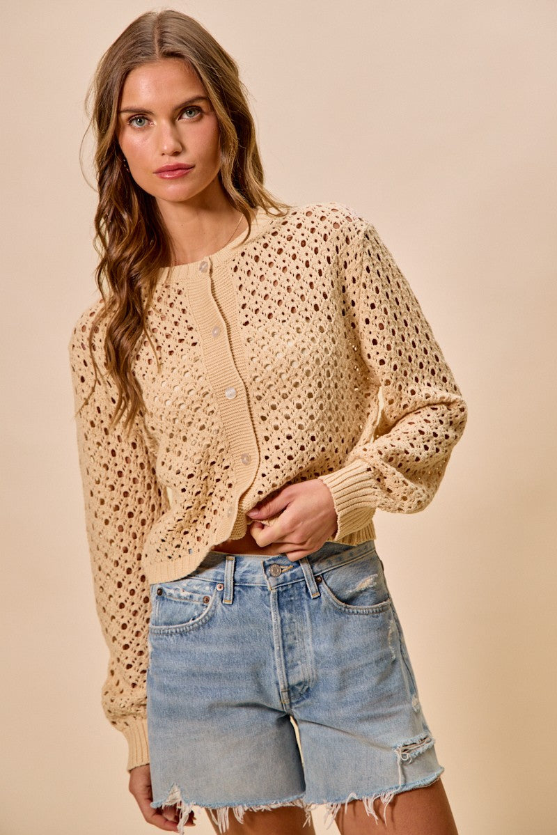 Model wearing Casey Open Knitted Button Down Cardigan natural knit sweater.