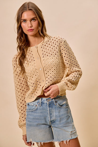 Model wearing Casey Open Knitted Button Down Cardigan natural knit sweater.