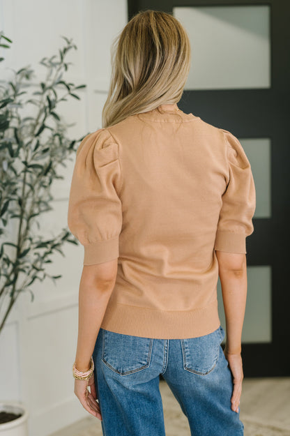 Back view of Giselle Puff Sleeve Blouse in Brush with ribbed hemline and cuffed sleeves