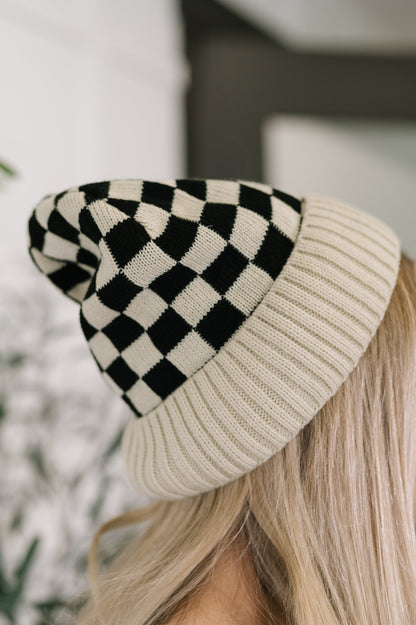 Model wearing Checkered Weather Beanie in Bone with lightweight knit and ribbed hem.