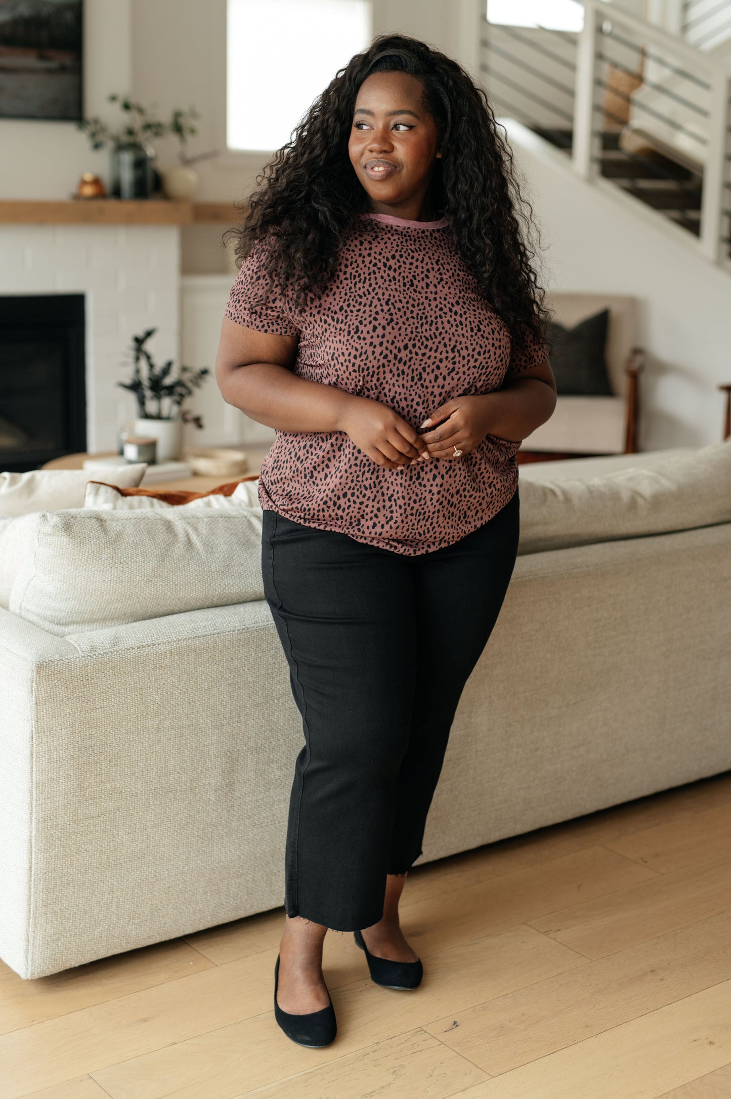 Pink women's top with cheetah print, featuring a crew neckline, short sleeves, and contrasting pink trim, made from lightweight Bulgari knit fabric.