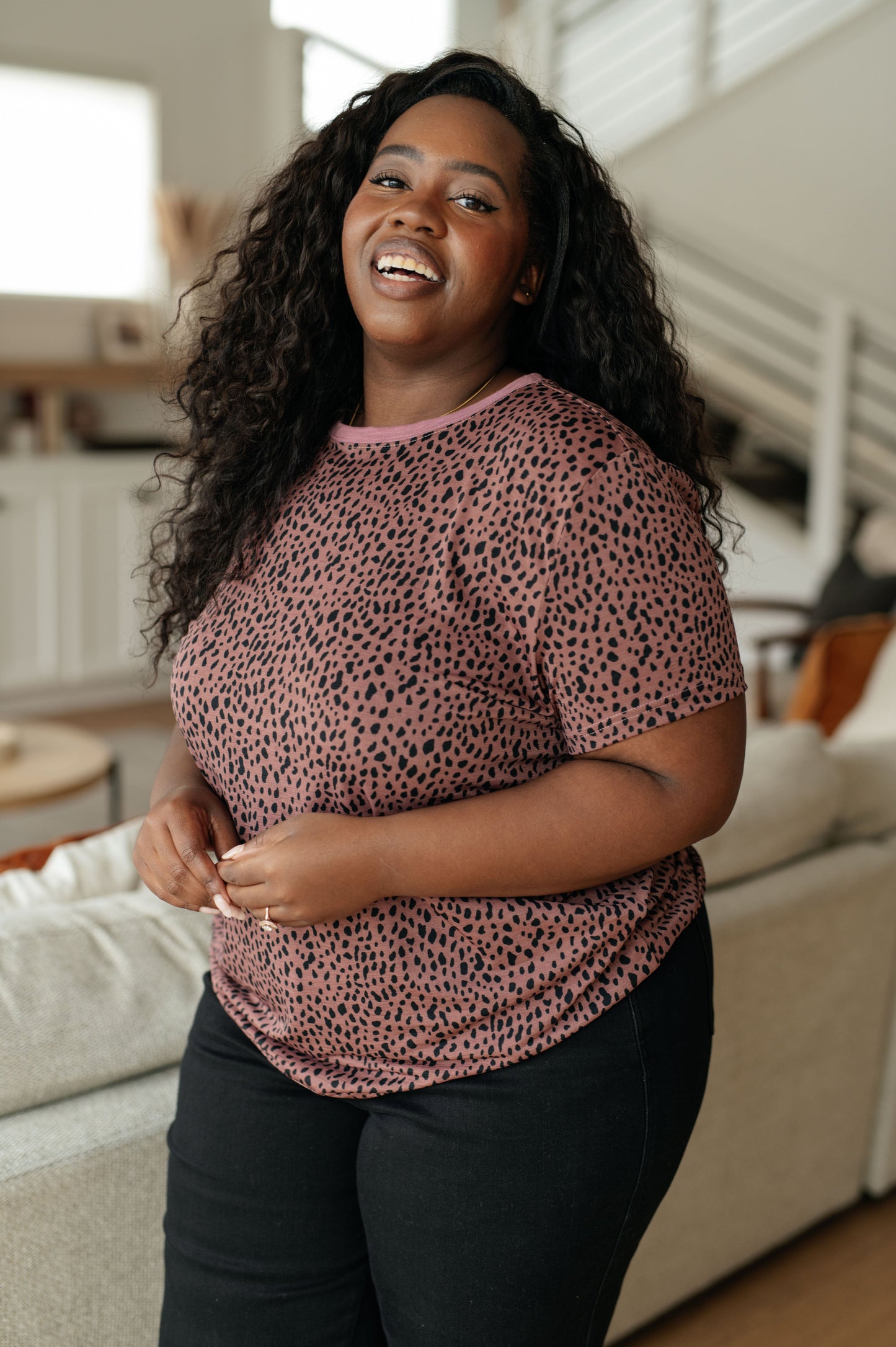 Pink women's top with cheetah print, featuring a crew neckline, short sleeves, and contrasting pink trim, made from lightweight Bulgari knit fabric.