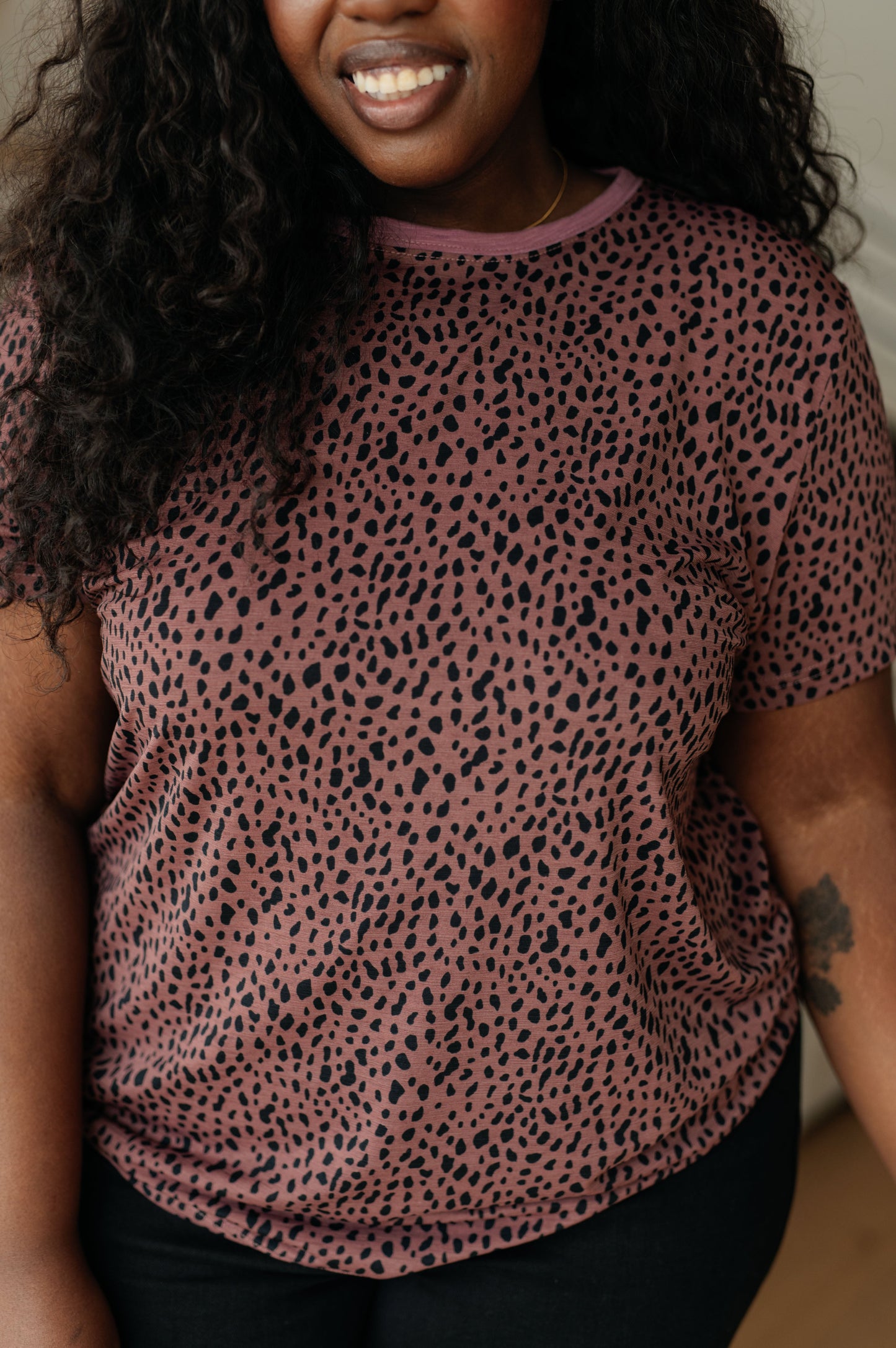 Mauve women's top with cheetah print, featuring a crew neckline, short sleeves, and contrasting pink trim, made from lightweight Bulgari knit fabric.