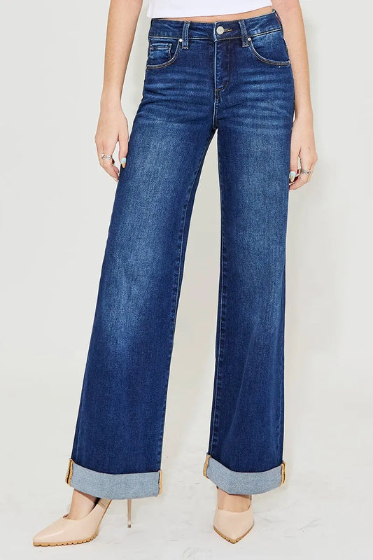 Front view of Risen Christina tummy control jeans in dark wash, high-rise with wide-leg silhouette and rolled cuffs.