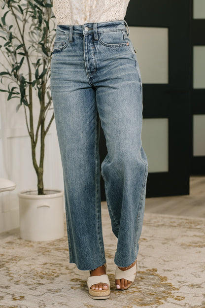 Model wearing Ciera High Waist Rigid Magic Wilhelmina Baggy Jeans by Judy Blue light wash denim.