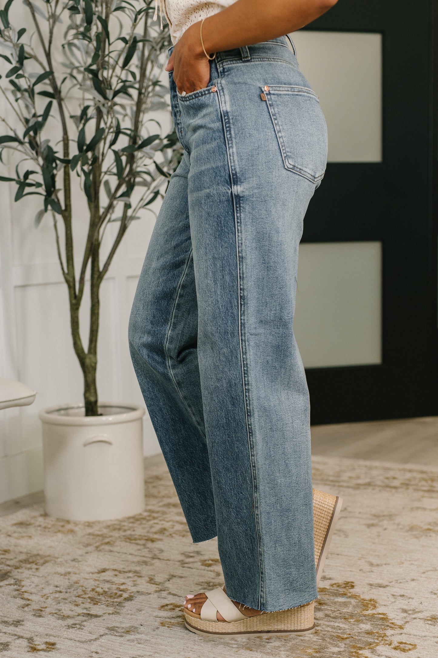 Side view of Ciera High Waist Rigid Magic Wilhelmina Baggy Jeans by Judy Blue relaxed silhouette.
