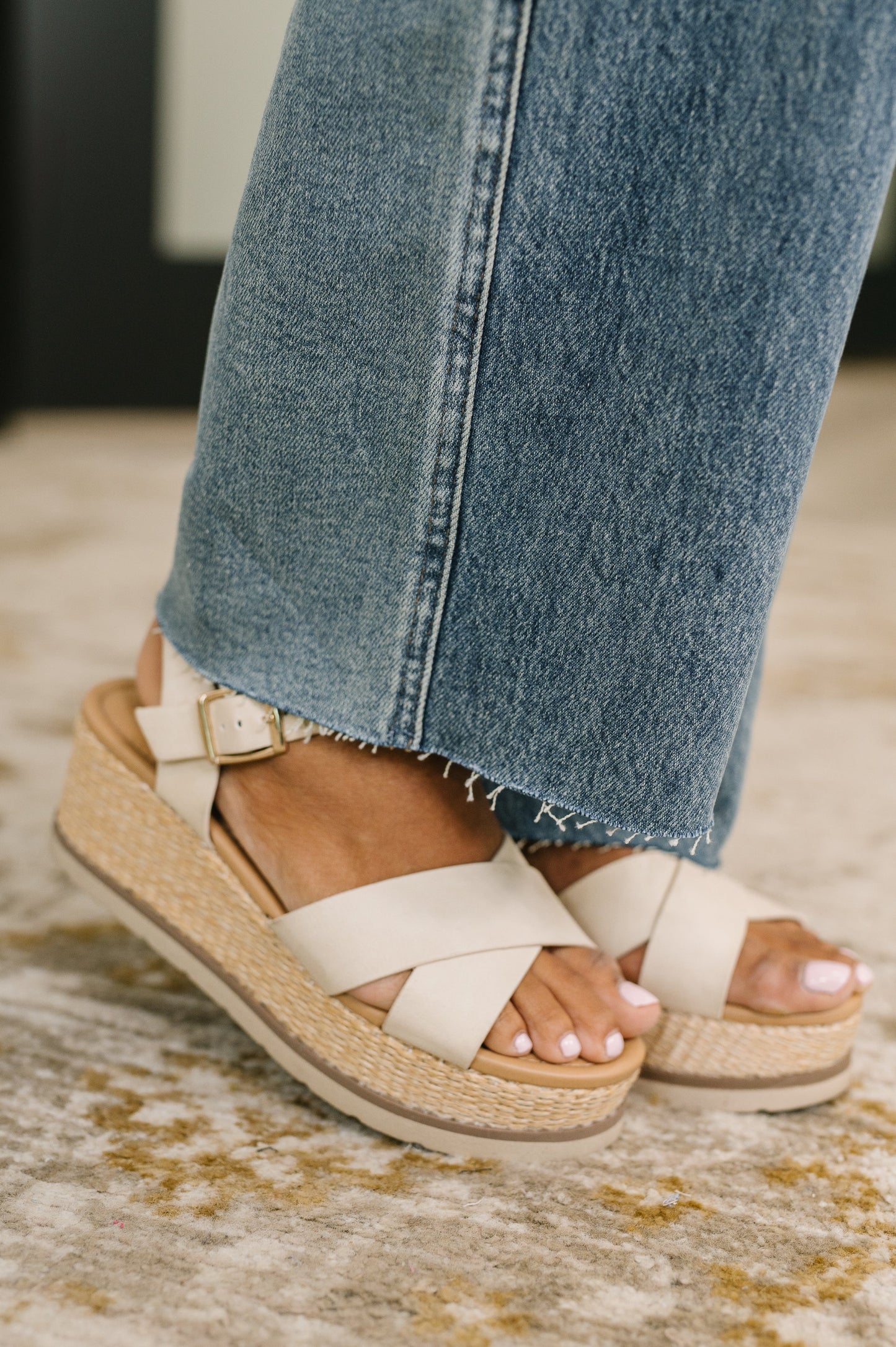 Close up of Ciera High Waist Rigid Magic Wilhelmina Baggy Jeans by Judy Blue raw hem detail.