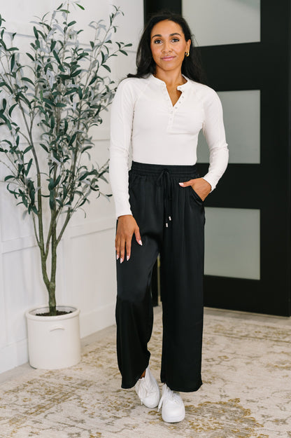 Size inclusive Cita Wide Leg Bottoms in Black with high waist and flowy fabric.