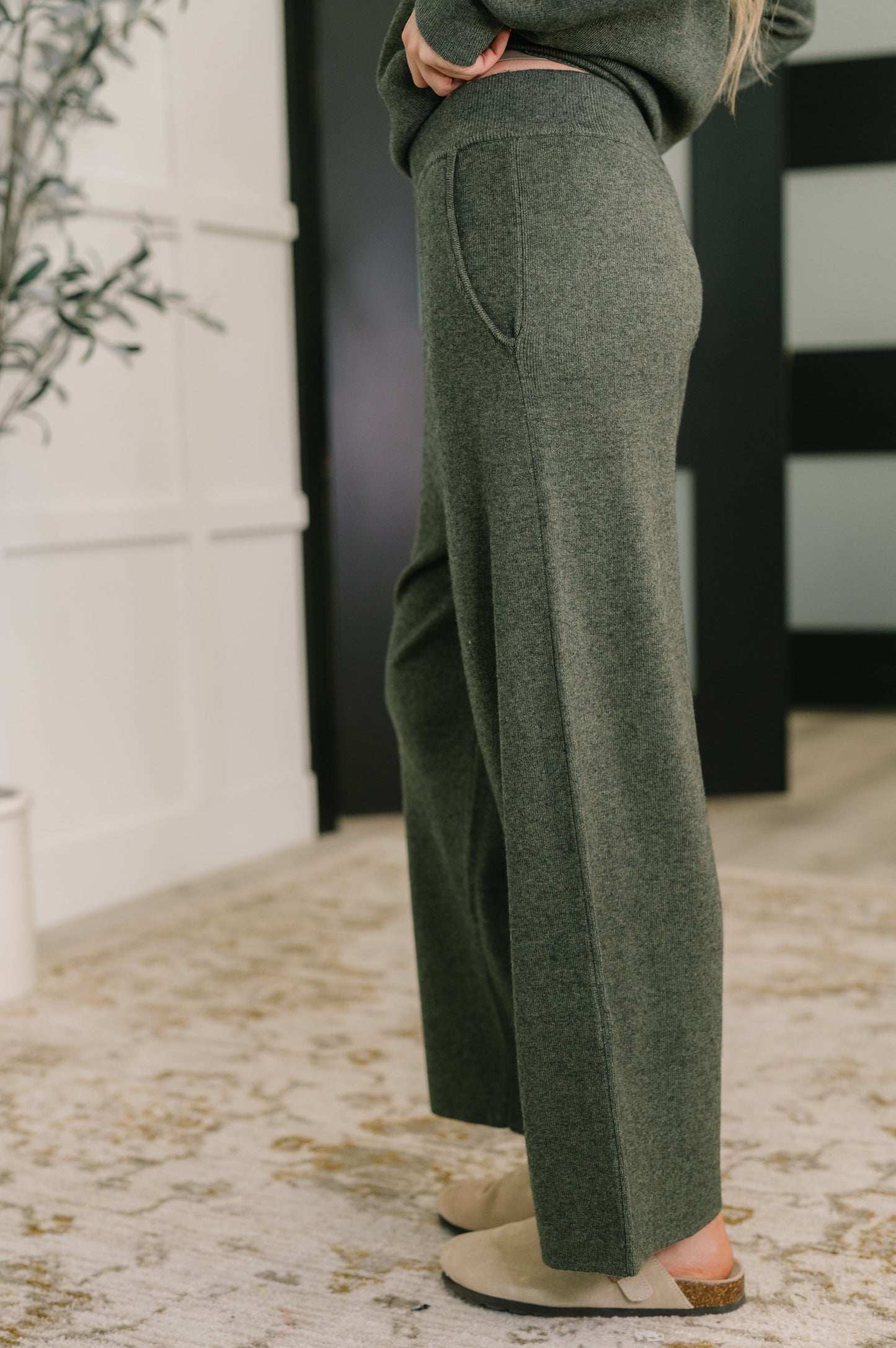 Side view of Clove Culottes in Moss highlighting wide leg silhouette and pockets